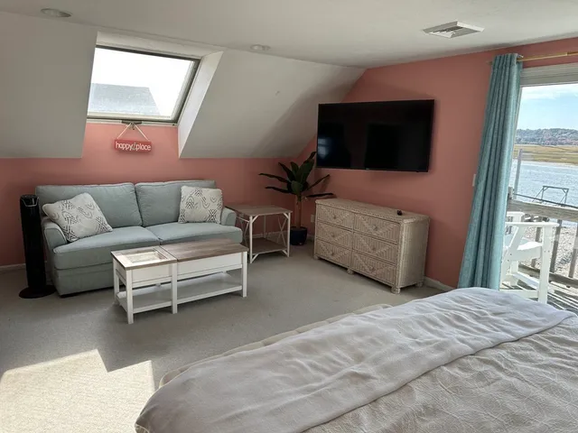 a terrace with outdoor seating and wooden floor