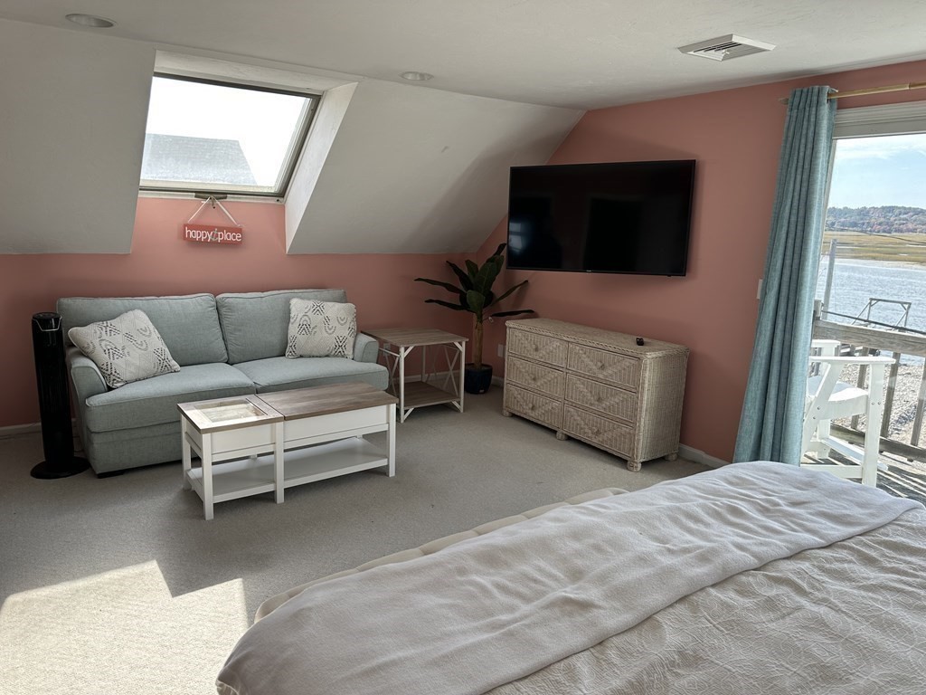 230 Central Avenue Scituate, MA 02050 - Photo 27 of 34 a bedroom with furniture and a flat screen tv