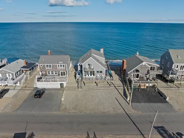 an aerial view of a houses with outdoor space
