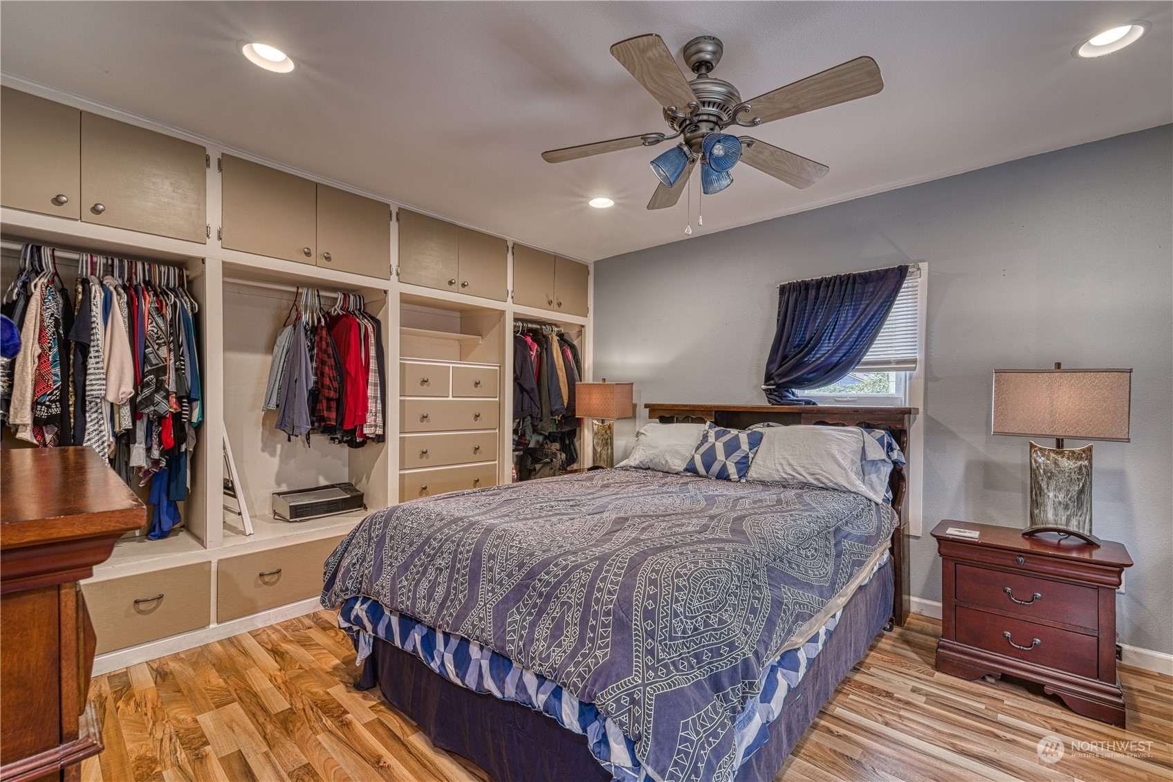1018 Sheridan Road Bremerton, WA 98310 - Photo 10 of 24 a bedroom with a large bed and a ceiling fan