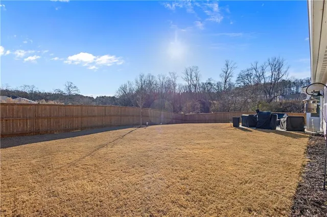 a backyard of a house with lots of green space