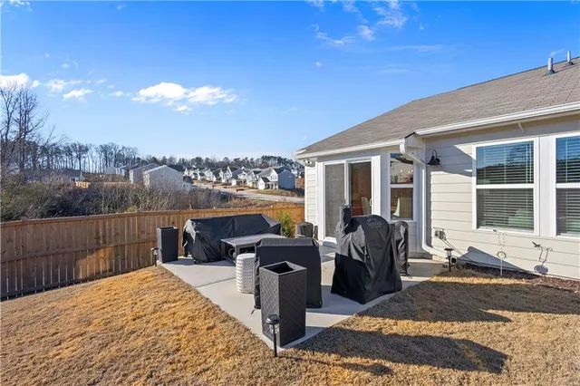 a view of a terrace with furniture and garden