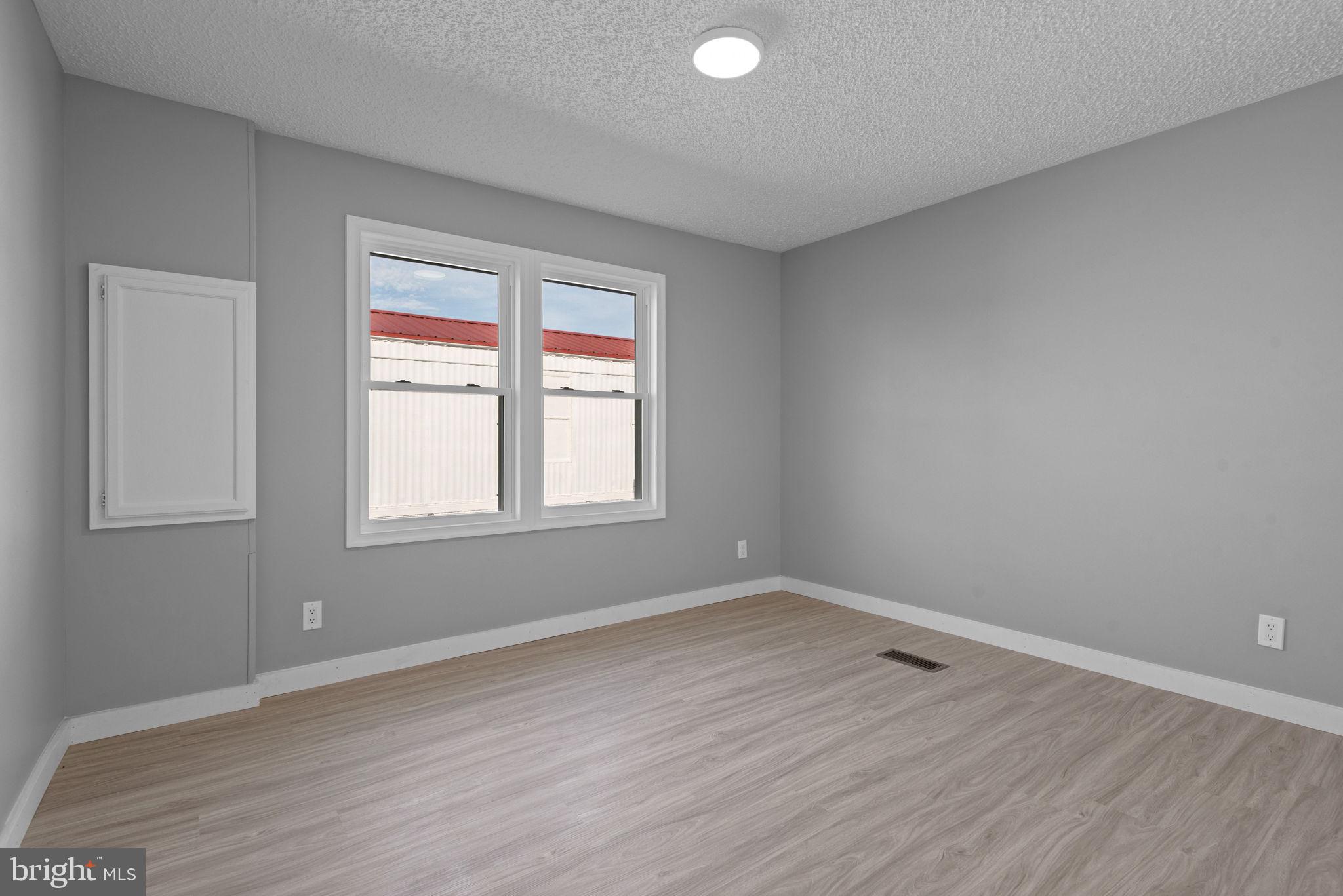 358 Pegram Street Gettysburg, PA 17325 - Photo 18 of 25 wooden floor in an empty room with a window