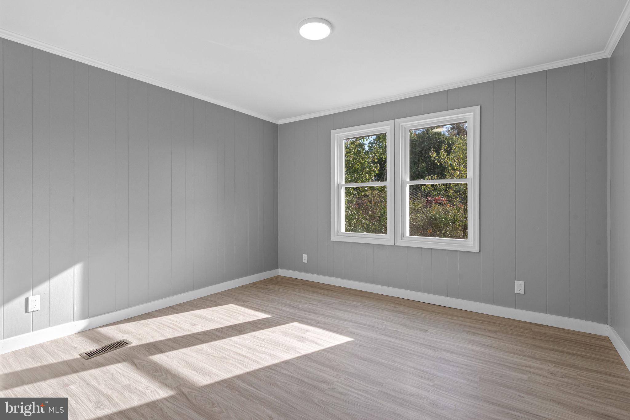 358 Pegram Street Gettysburg, PA 17325 - Photo 20 of 25 a view of an empty room with wooden floor and a window