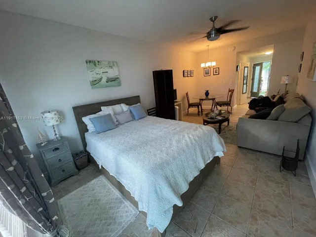 a bed room with a bed and a couch