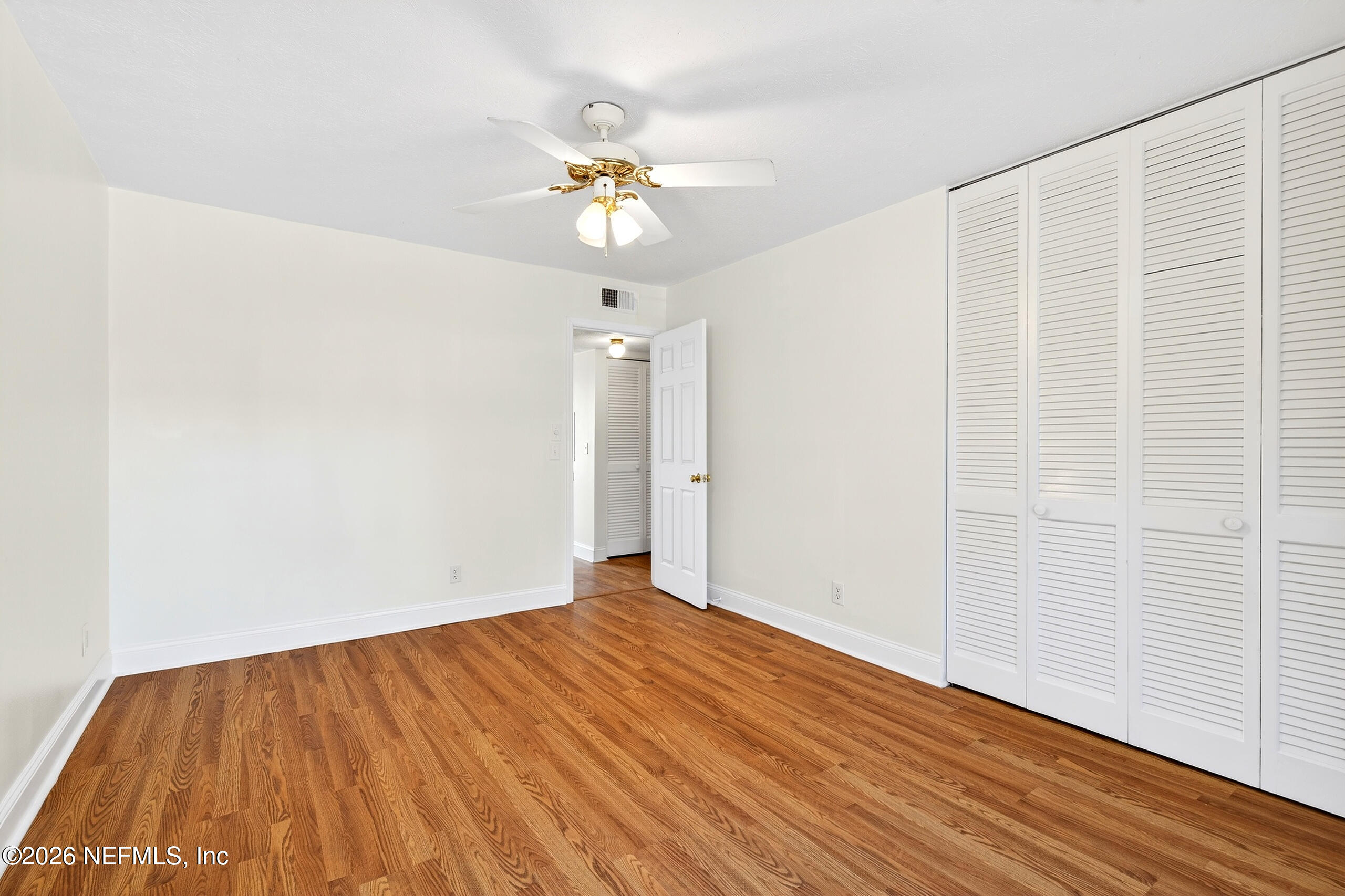 4358 Timuquana Road, Unit 150 Jacksonville, FL 32210 - Photo 11 of 21 wooden floor in an empty room
