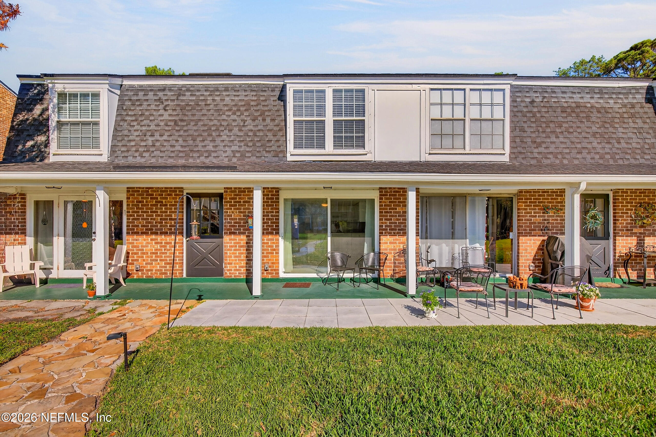 4358 Timuquana Road, Unit 150 Jacksonville, FL 32210 - Photo 16 of 21 front view of a brick house with a yard