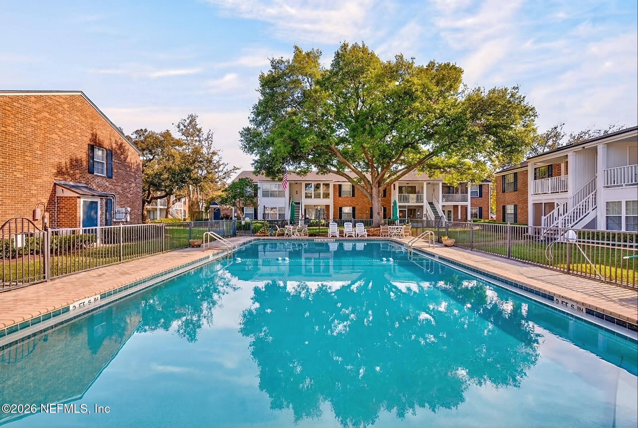 4358 Timuquana Road, Unit 150 Jacksonville, FL 32210 - Photo 20 of 21 a view of a swimming pool with a patio