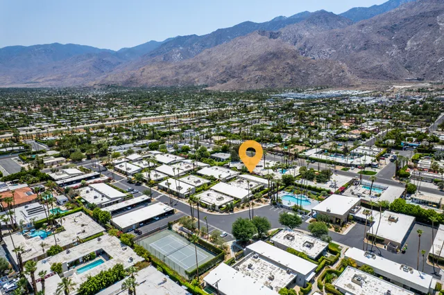 an aerial view of a city and mountain view