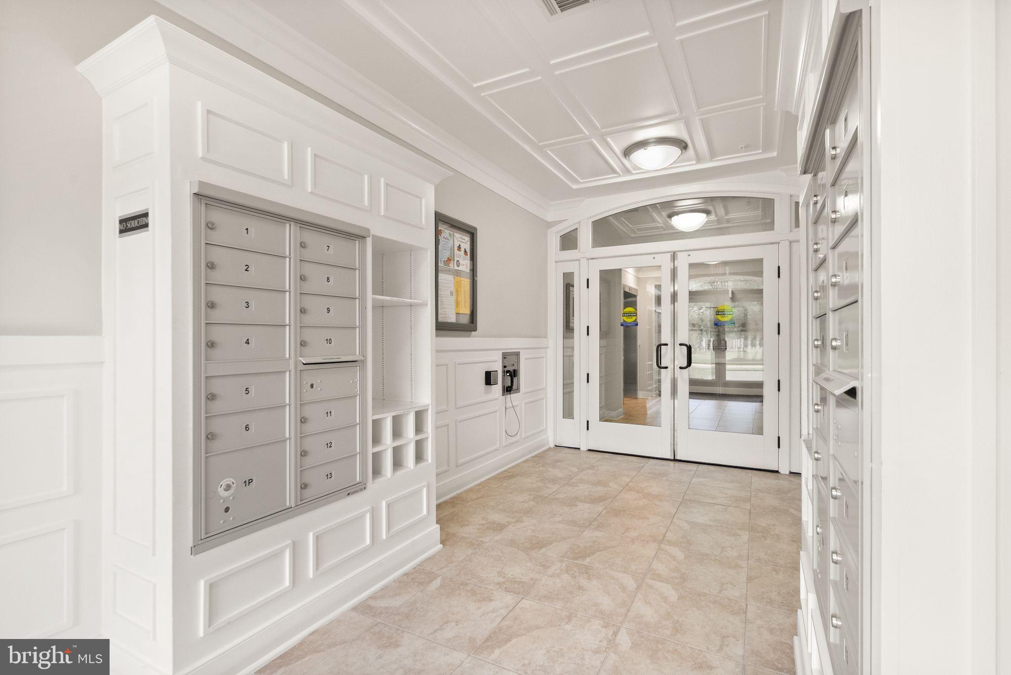 20610 Hope Spring Terrace, Unit 104 Ashburn, VA 20147 - Photo 3 of 38 Elegant entryway with mailboxes.