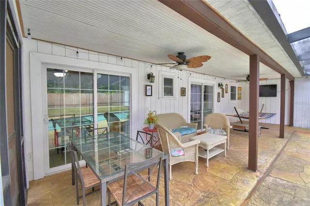 a view of a swimming pool with a patio