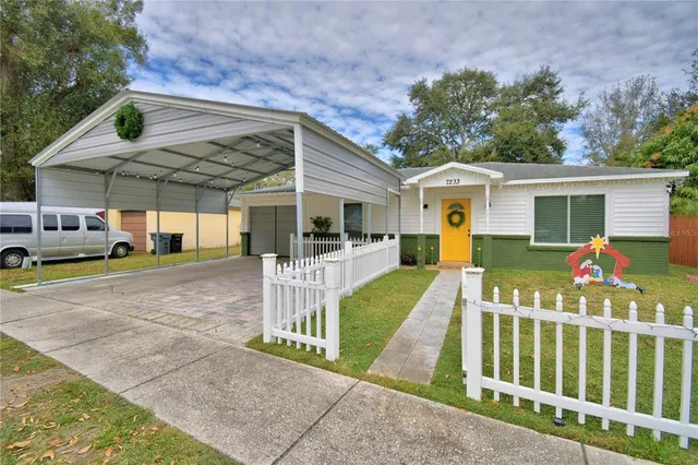a view of a house with a yard porch and sitting area