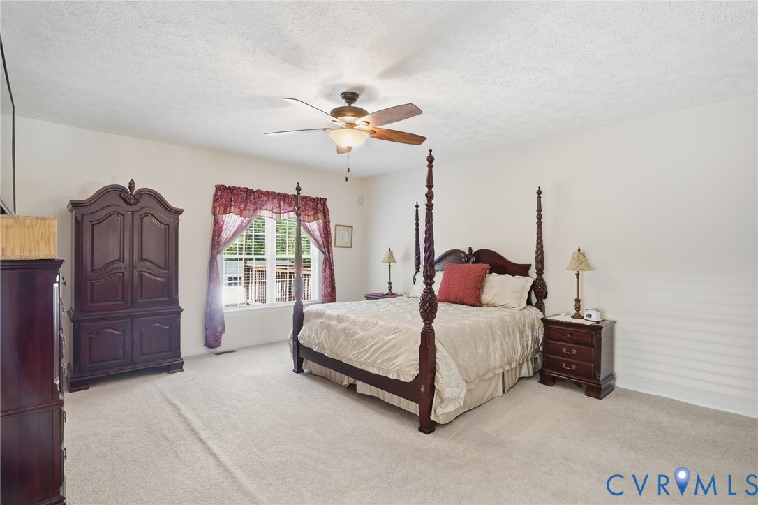 3600 Market Road Mechanicsville, VA 23111 - Photo 27 of 67 a living room with a bed furniture and a window