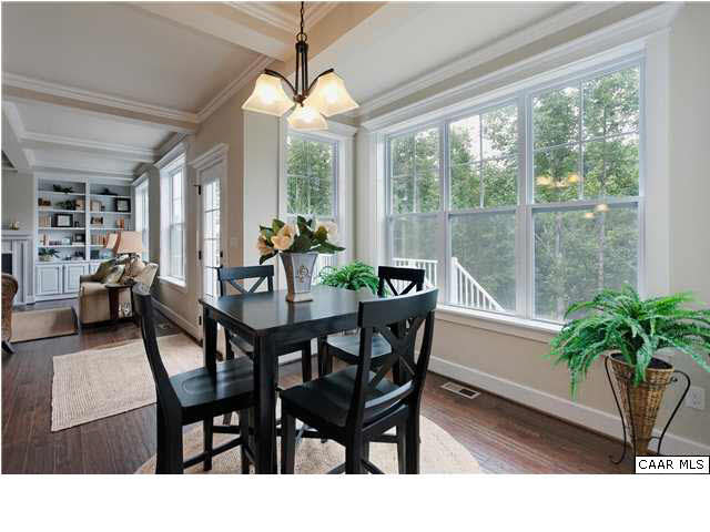 5309 Raven Stone Road Crozet, VA 22932 - Photo 12 of 38 a view of a dining room with furniture window and wooden floor