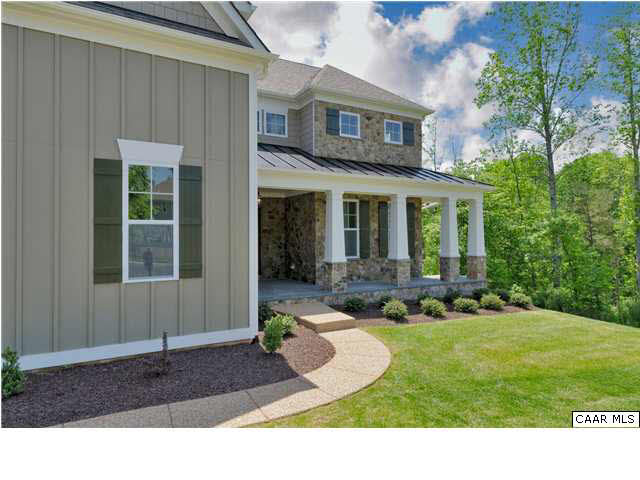 5309 Raven Stone Road Crozet, VA 22932 - Photo 2 of 38 a front view of a house with a yard