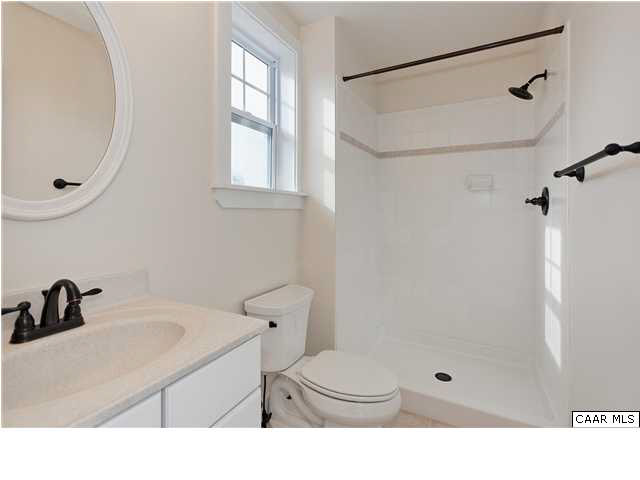 5309 Raven Stone Road Crozet, VA 22932 - Photo 25 of 38 a bathroom with a sink a toilet and a mirror