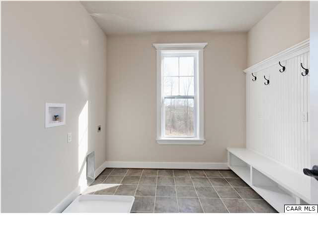 5309 Raven Stone Road Crozet, VA 22932 - Photo 27 of 38 a bathroom with a tub shower and a window