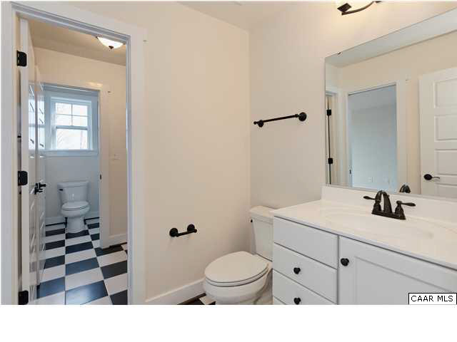 5309 Raven Stone Road Crozet, VA 22932 - Photo 31 of 38 a bathroom with a sink a toilet and shower
