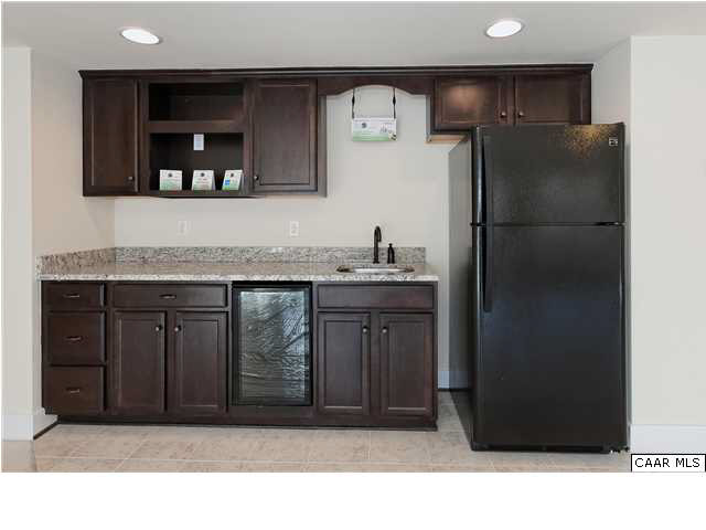 5309 Raven Stone Road Crozet, VA 22932 - Photo 34 of 38 a kitchen with a refrigerator and cabinets