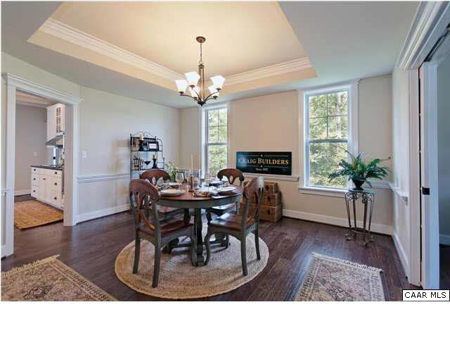 5309 Raven Stone Road Crozet, VA 22932 - Photo 7 of 38 a living room filled with furniture and a chandelier