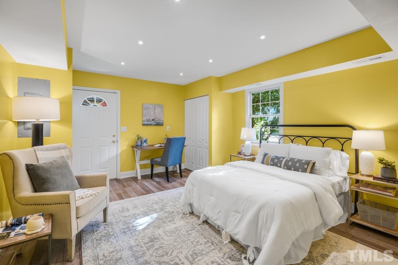 4108 Pleasant Grove Church Road Raleigh, NC 27613 - Photo 15 of 30 a bedroom with a bed and lamp