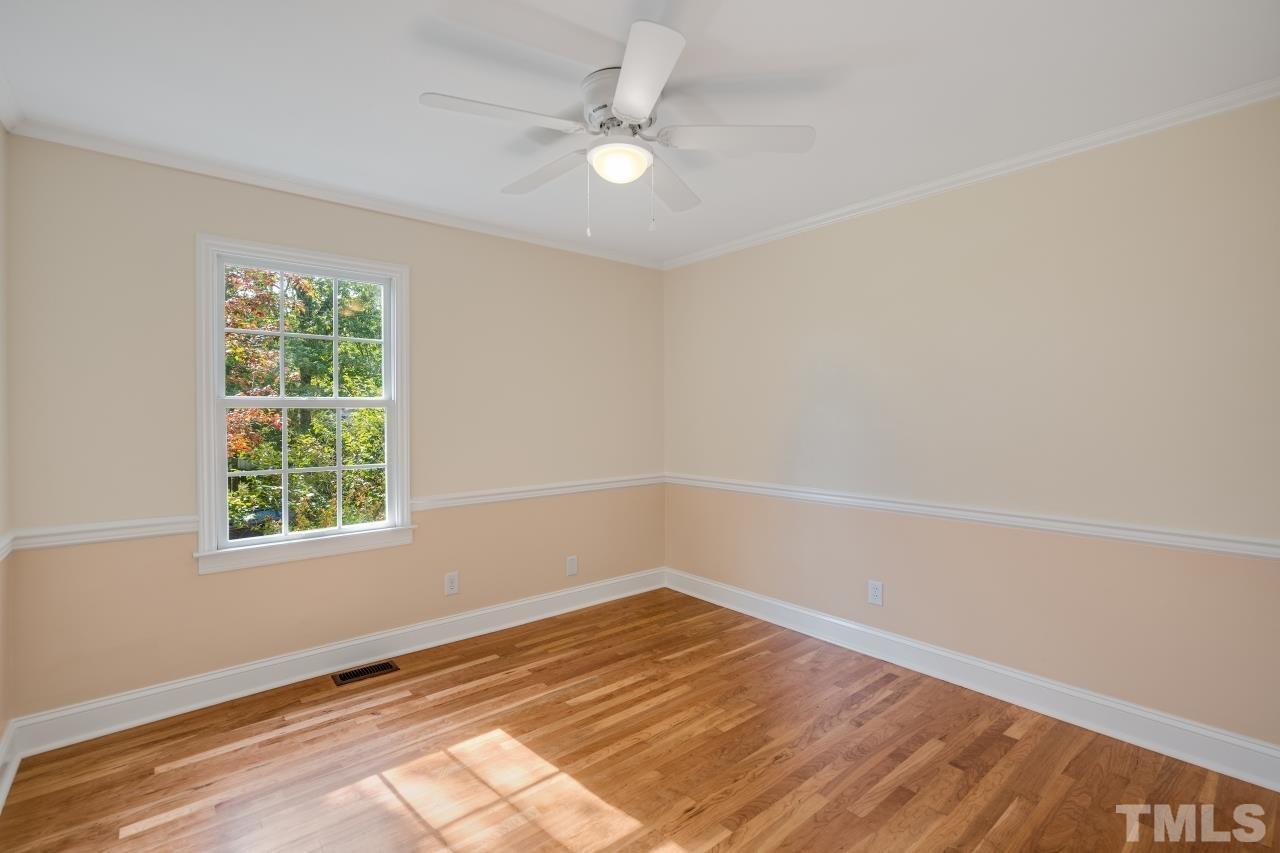 4108 Pleasant Grove Church Road Raleigh, NC 27613 - Photo 21 of 30 wooden floor in an empty room with a window