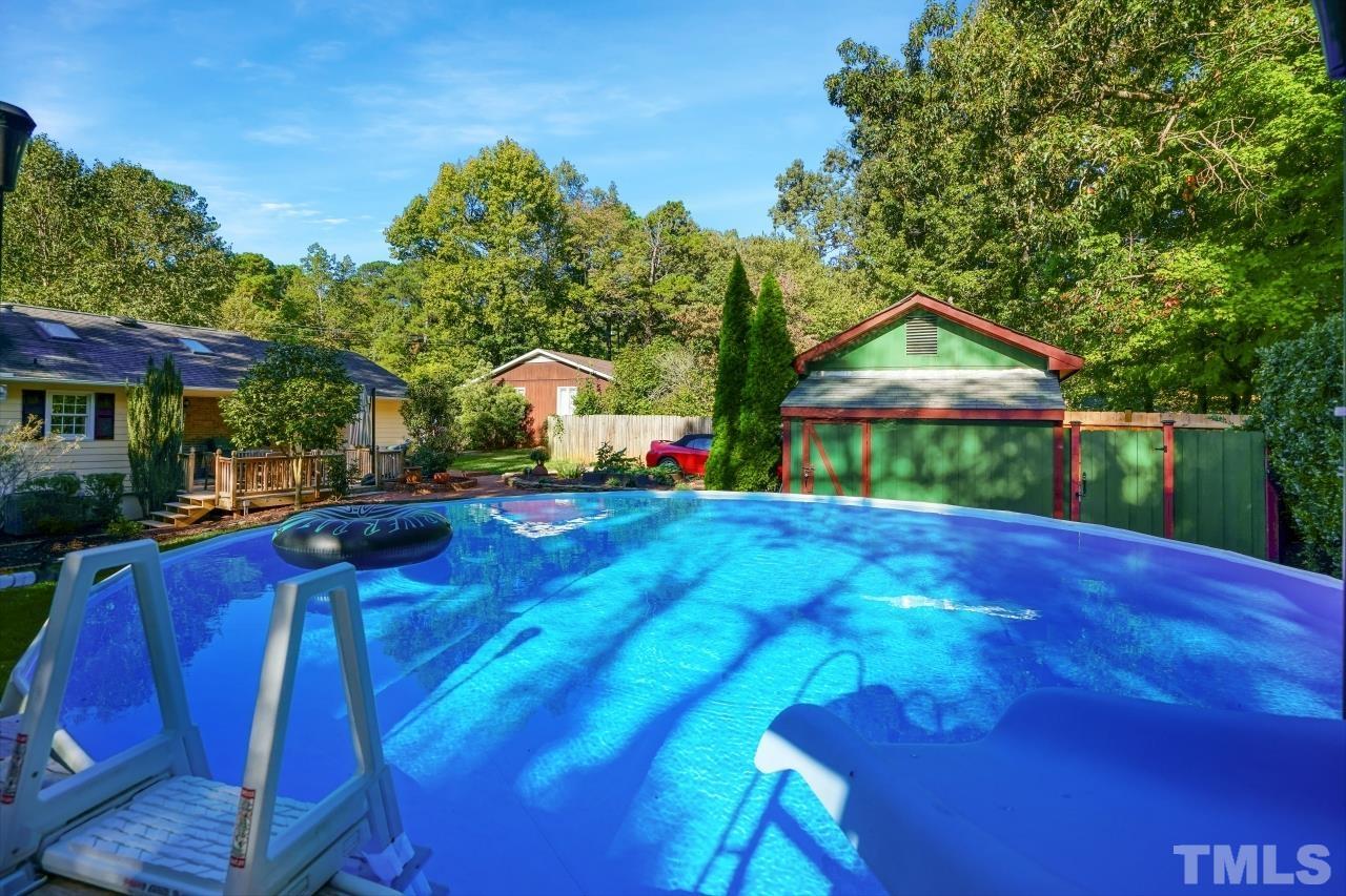 4108 Pleasant Grove Church Road Raleigh, NC 27613 - Photo 23 of 30 a view of swimming pool with lawn chairs and plants