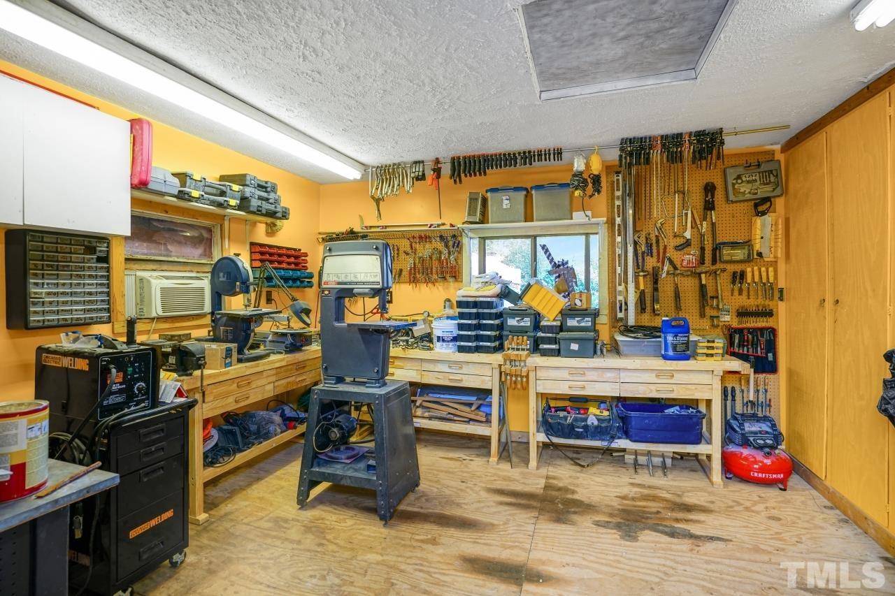 4108 Pleasant Grove Church Road Raleigh, NC 27613 - Photo 29 of 30 a view of a living room with furniture and a flat screen tv