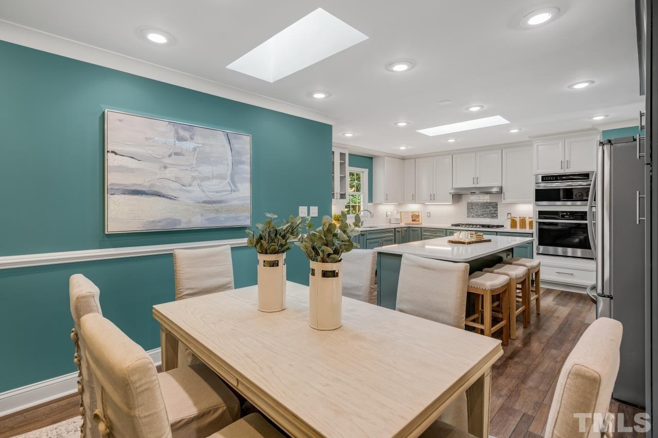 4108 Pleasant Grove Church Road Raleigh, NC 27613 - Photo 6 of 30 a kitchen with a table and chairs