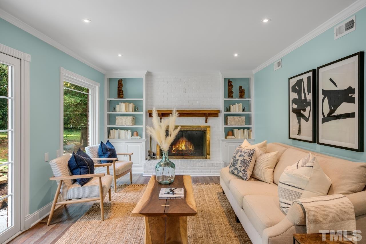 4108 Pleasant Grove Church Road Raleigh, NC 27613 - Photo 10 of 30 a living room with furniture and a fireplace
