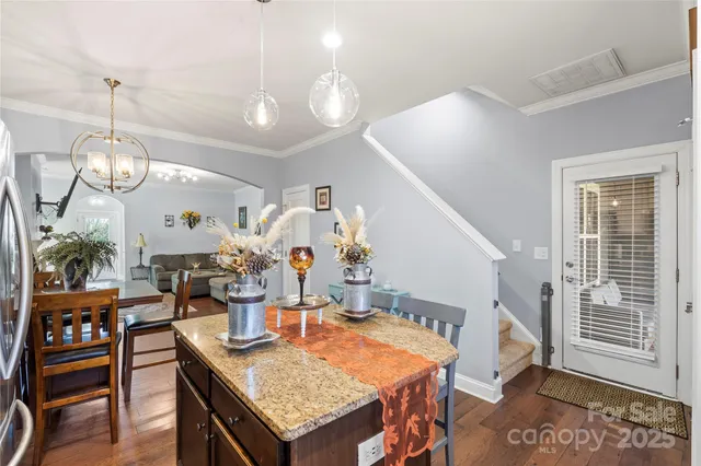 a bedroom with a bed and a large window with the outer view