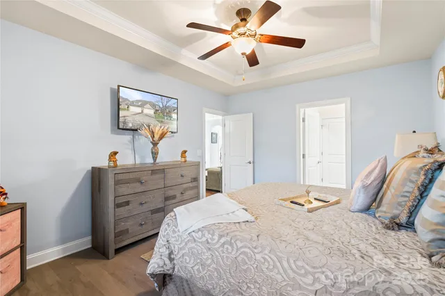 a bathroom with a granite countertop sink mirror vanity and toilet
