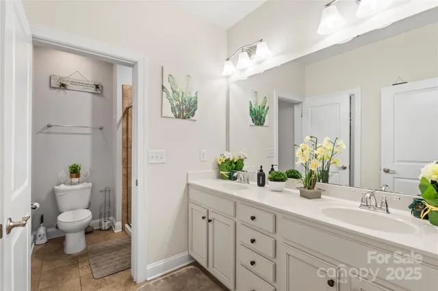 a bath room with a sink and a mirror