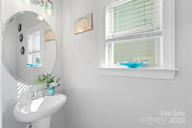 a vase with flowers sitting on a deck