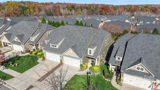 an aerial view of a house with a mountain view