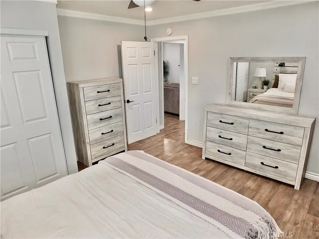 a bedroom with a bed and a dresser