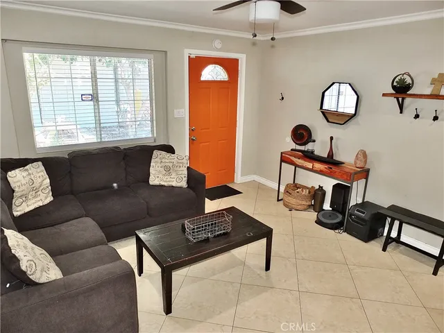 a kitchen with stainless steel appliances granite countertop a stove a table and a refrigerator