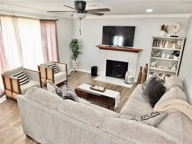 a living room with furniture and a fireplace
