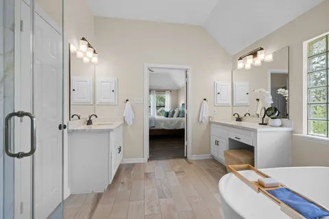 a bathroom with a sink double vanity and a mirror