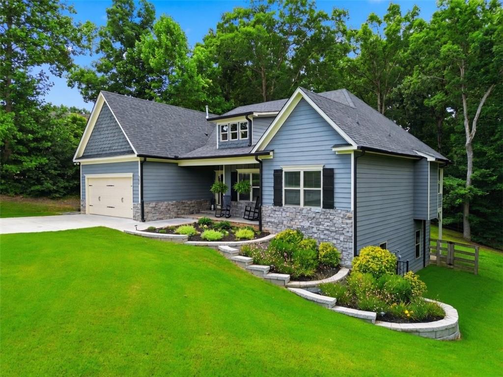 302 Spence Circle Ball Ground, GA 30107 - Photo 4 of 55 a front view of house with yard and green space