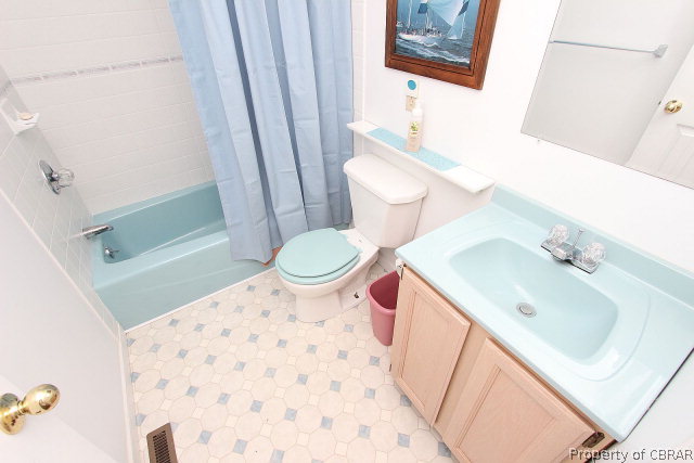 80 Deer Run Road Lancaster, VA 22503 - Photo 22 of 32 a bathroom with a sink a toilet and shower