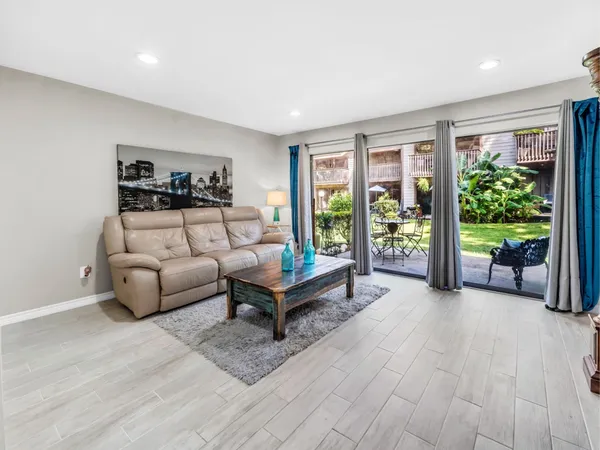 a living room with furniture and a rug