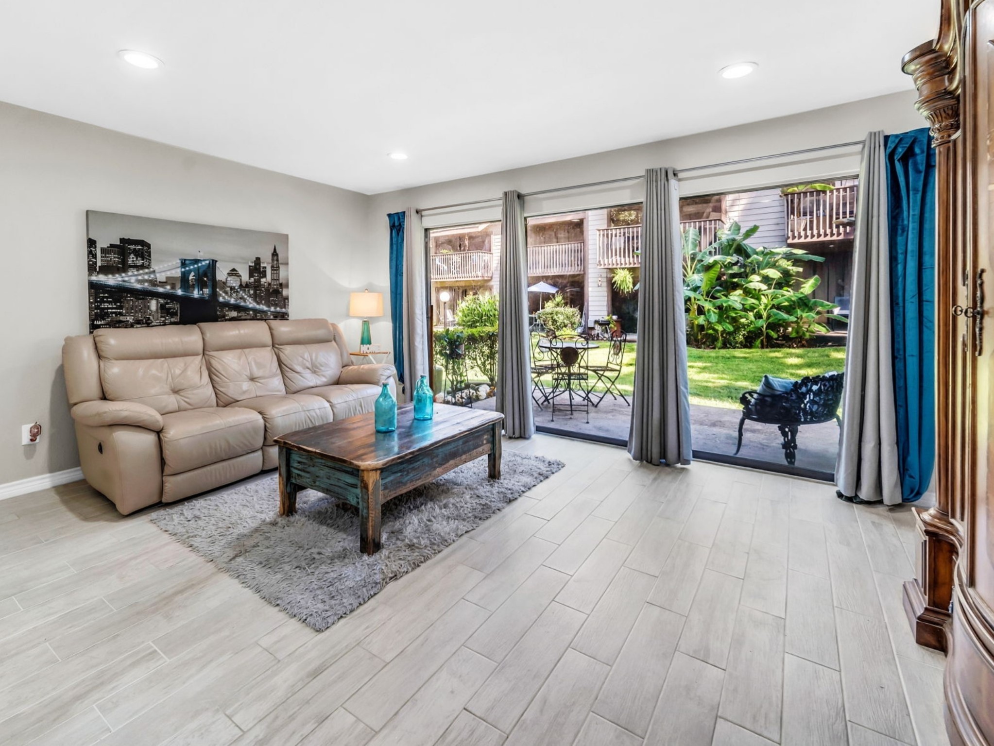 12900 Walden Road, Unit 505 Montgomery, TX 77356 - Photo 1 of 50 a living room with furniture and a potted plant