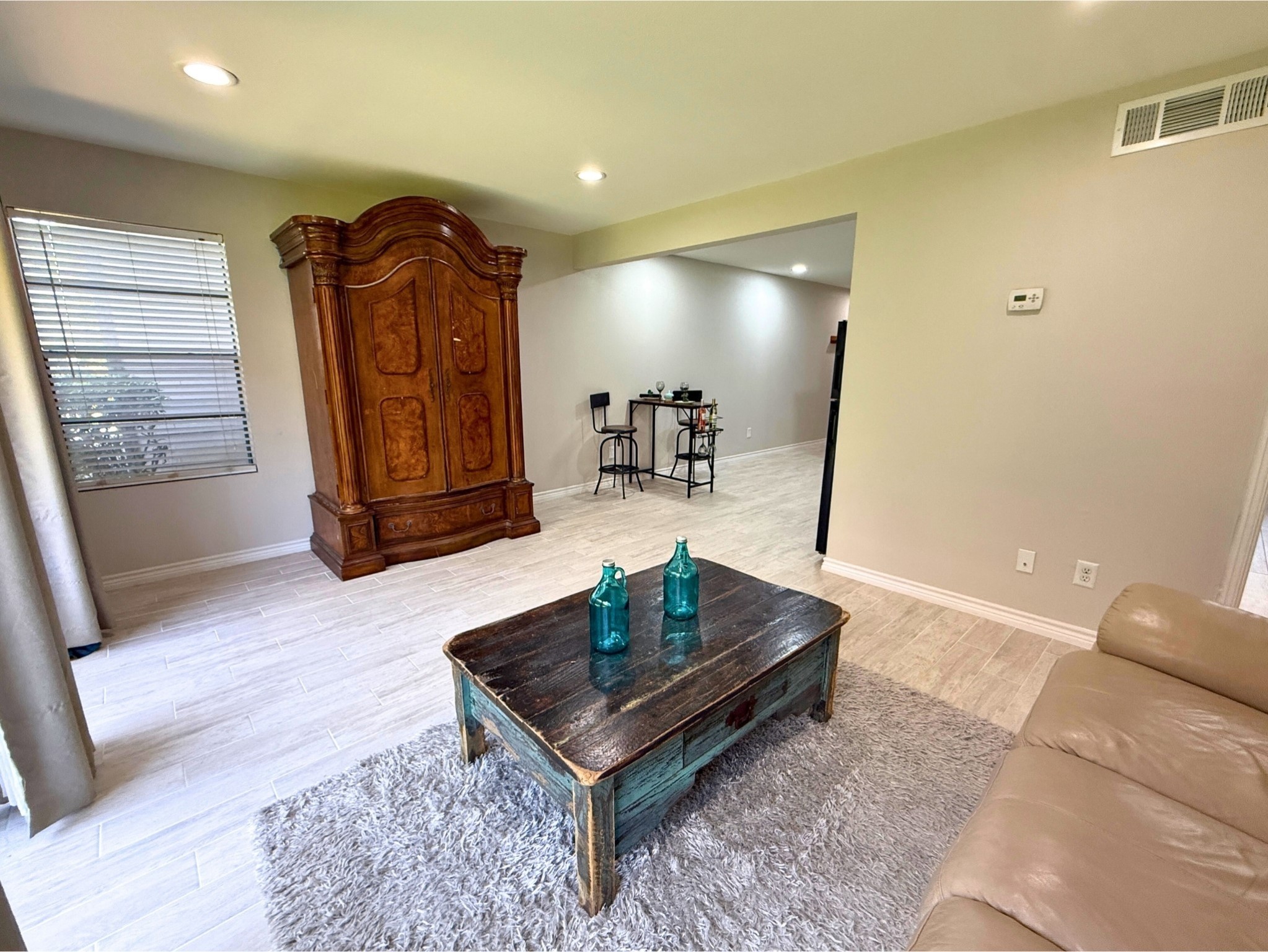 12900 Walden Road, Unit 505 Montgomery, TX 77356 - Photo 11 of 50 a living room with couch and a wooden floor