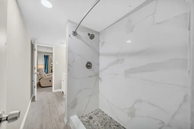 a bedroom with a bed and a couch