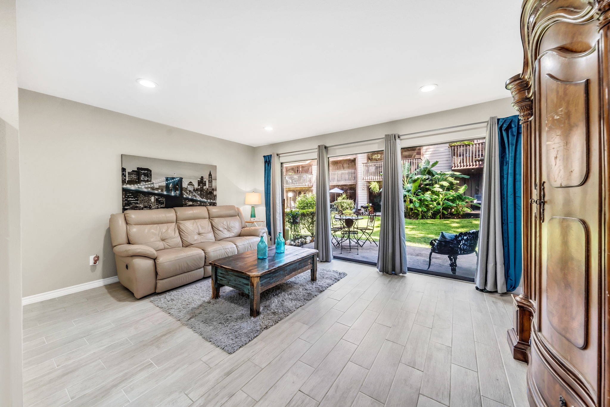 12900 Walden Road, Unit 505 Montgomery, TX 77356 - Photo 25 of 50 a living room with furniture and a floor to ceiling window