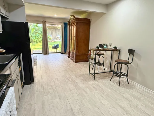 a view of a big yard with palm trees