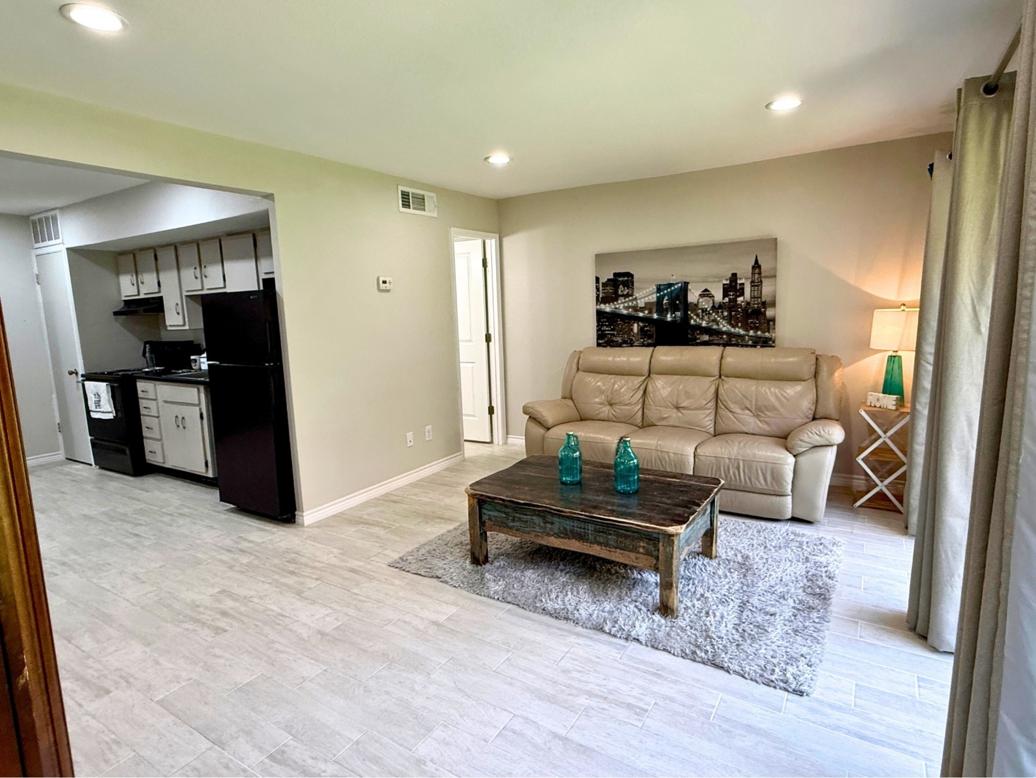 12900 Walden Road, Unit 505 Montgomery, TX 77356 - Photo 27 of 50 a living room with furniture and a wooden floor
