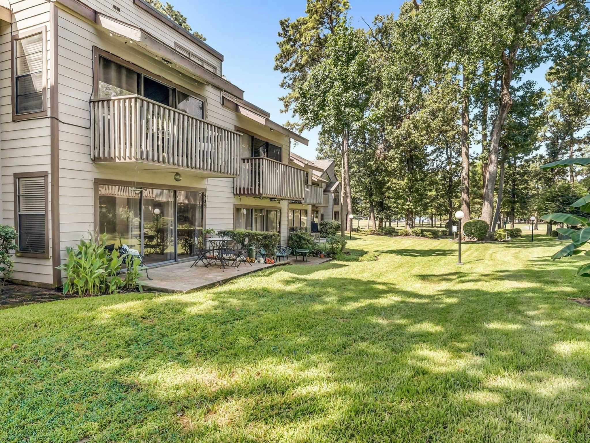12900 Walden Road, Unit 505 Montgomery, TX 77356 - Photo 28 of 50 a view of a house with swimming pool and sitting area