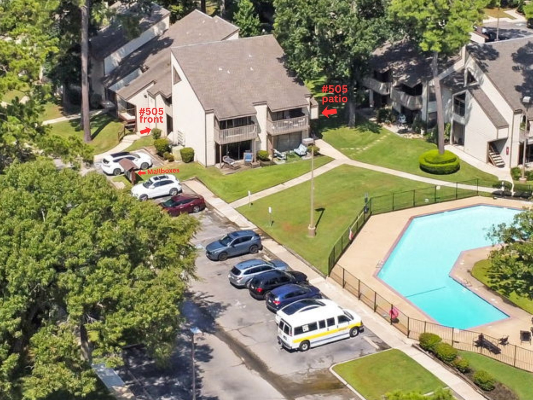 12900 Walden Road, Unit 505 Montgomery, TX 77356 - Photo 43 of 50 an aerial view of a tennis ground and large trees